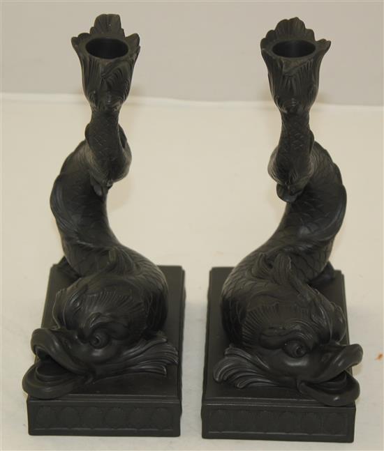 A pair of Wedgwood black basalt dolphin candlesticks, 21.5cm